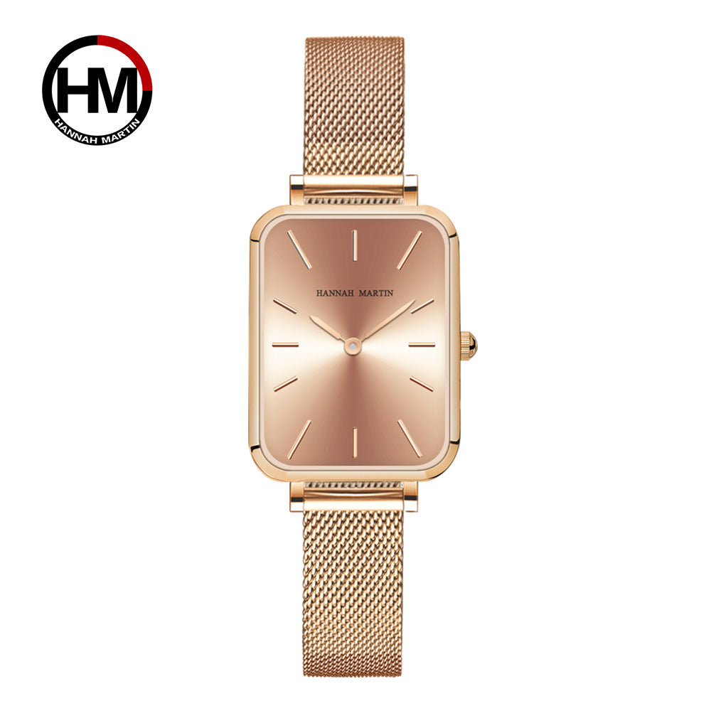 Rose gold watch with mesh band on a white background, featuring the Hannah Martin logo.