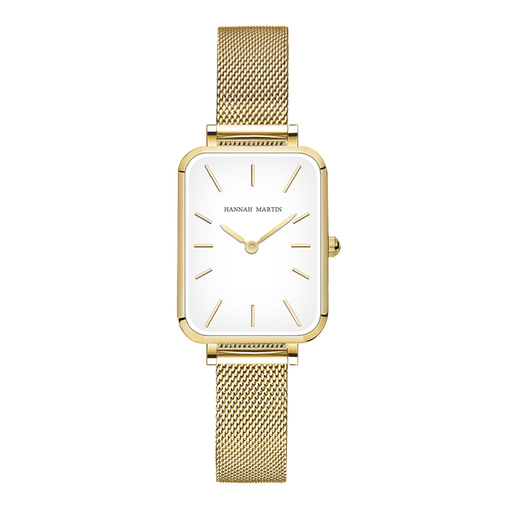 Gold watch with a white face on a white background